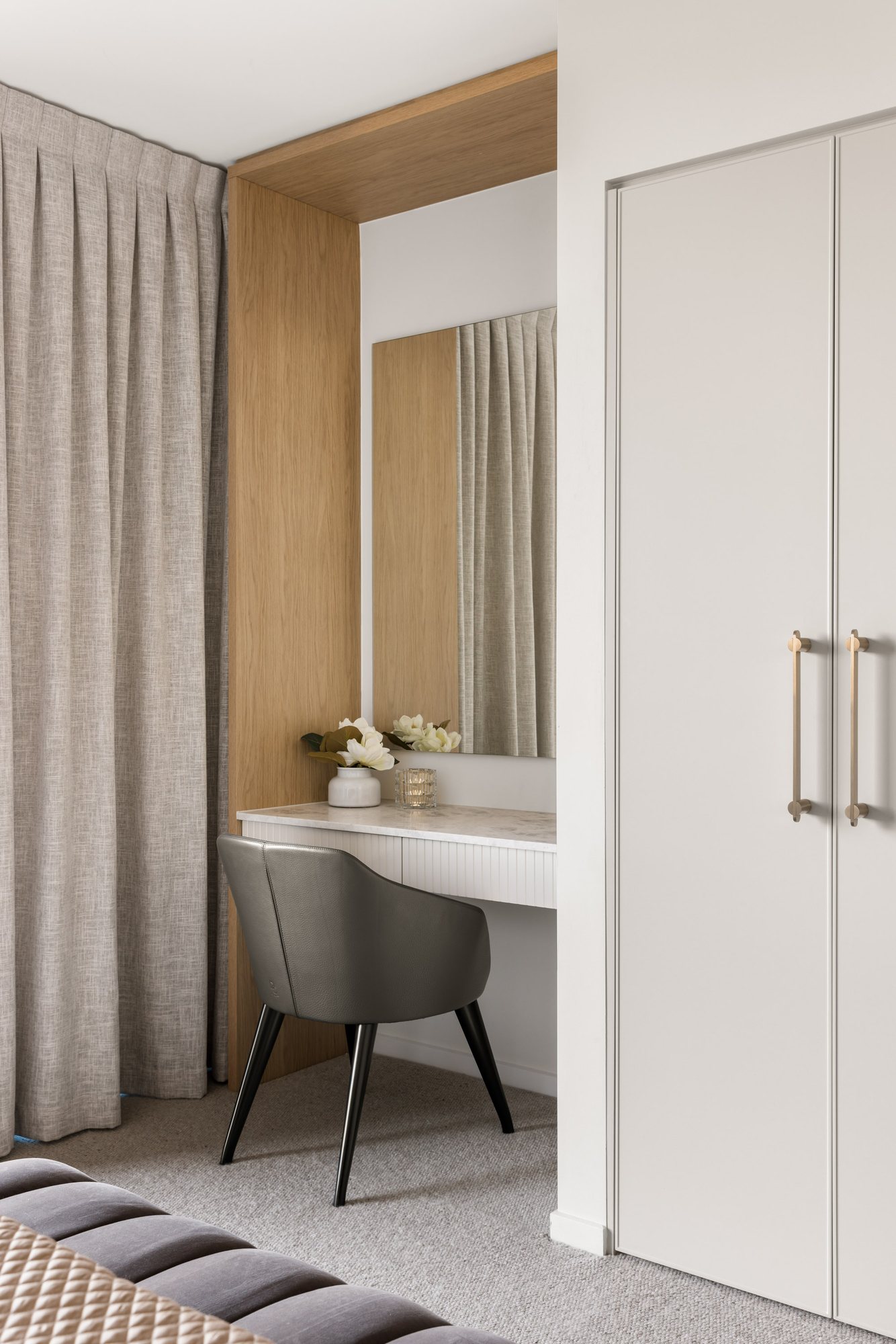 Timber-framed dressing nook with a mirror, marble shelf and leather chair — Stradbroke Villa 8